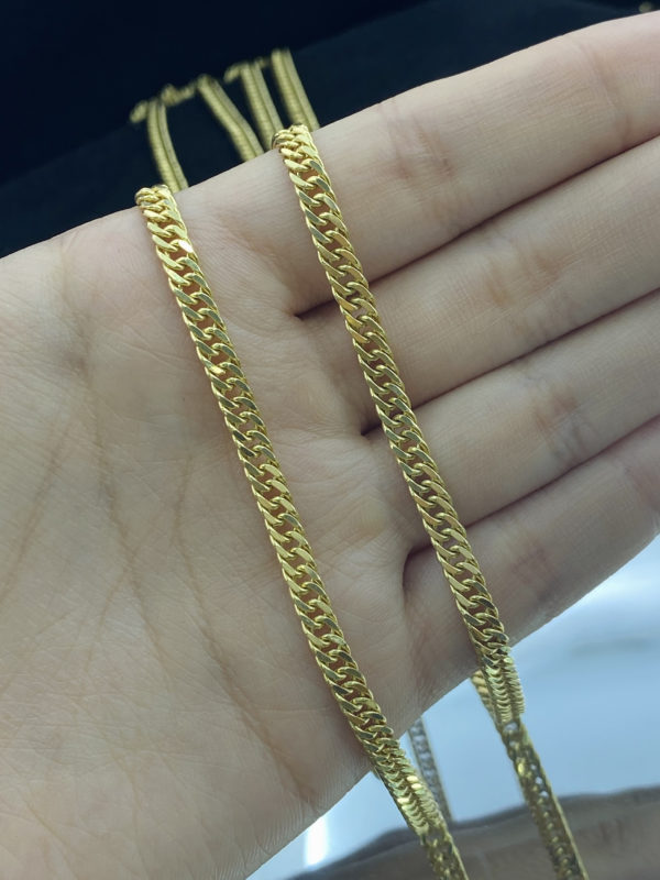 Cadena doble curva para caballero, oro de 18k.